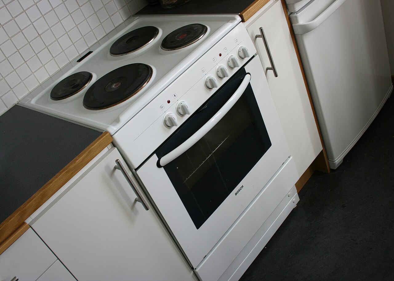Modern electric stove with ceramic hob top