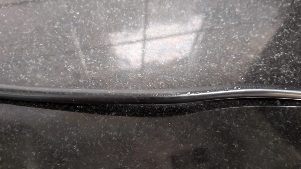 Printed markings on a black flexible cable jacket reading 3G0.75mm&sup2; and 300/500V